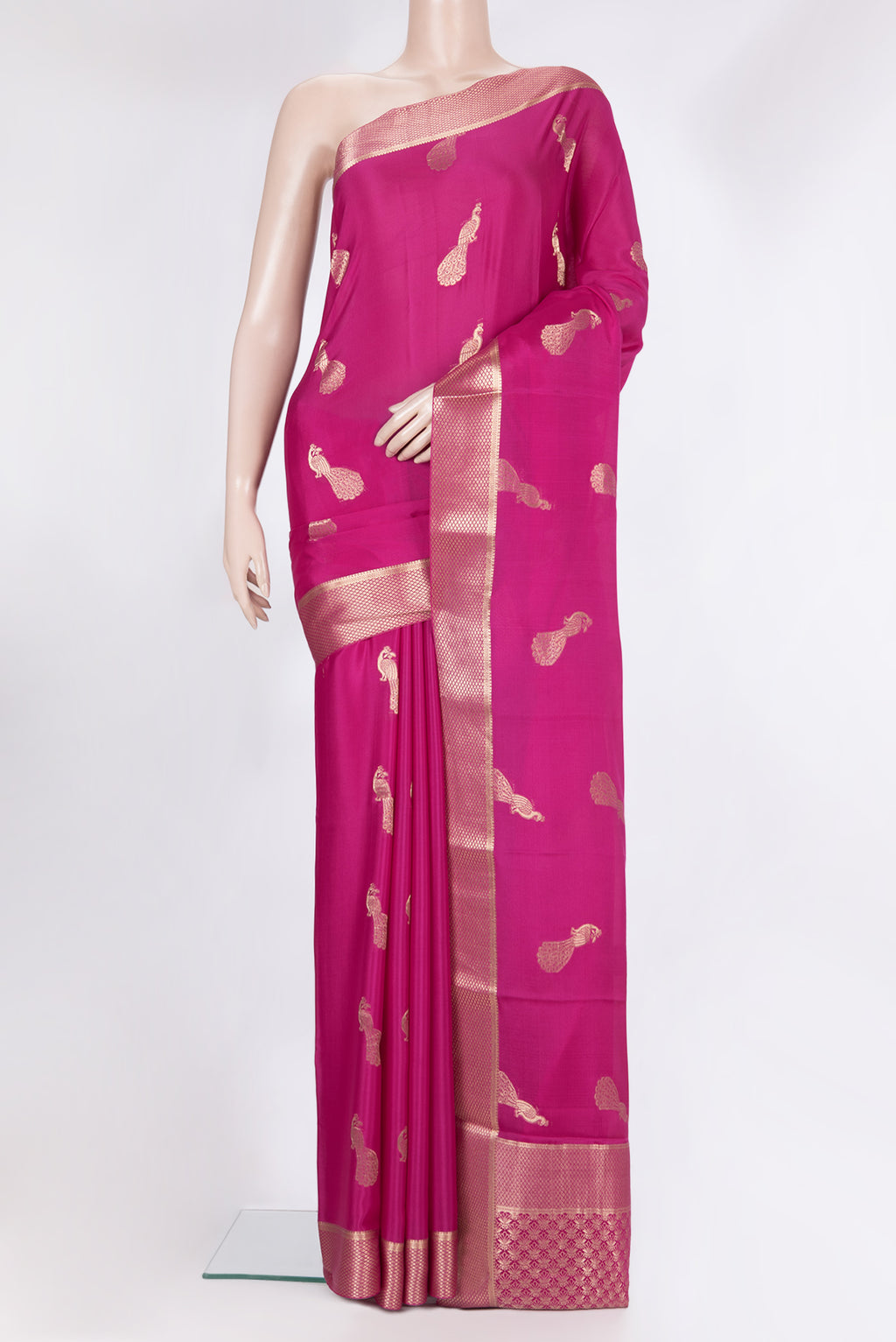 Dark Pink Mysore Crepe Saree with Zari Butta on the body and Fancy Border.  displayed on a mannequin
