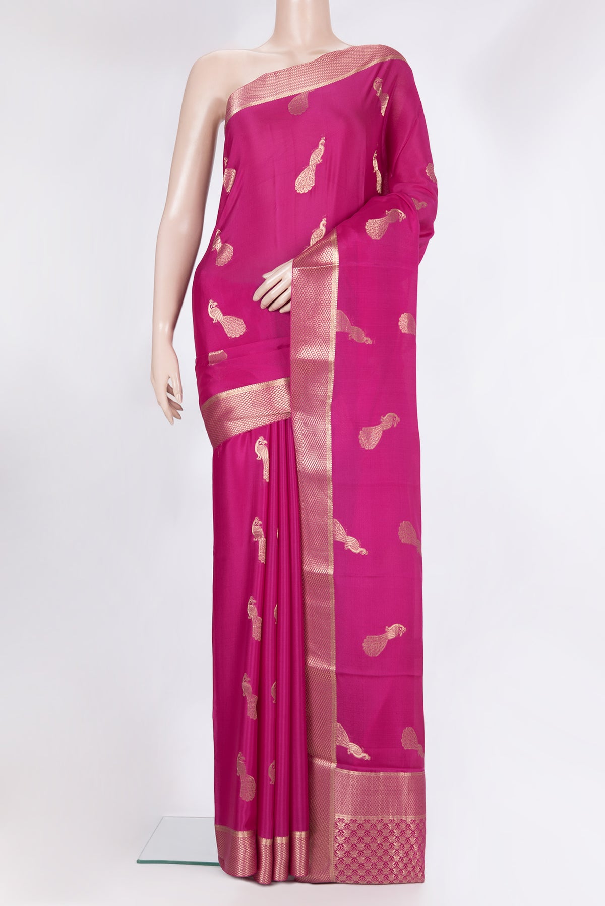 Dark Pink Mysore Crepe Saree with Zari Butta on the body and Fancy Border.  displayed on a mannequin