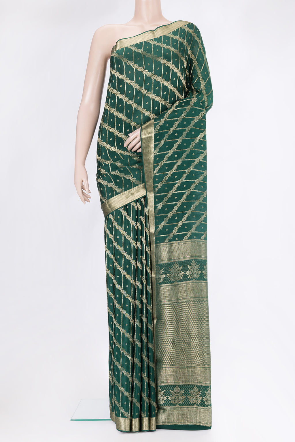 Bottle Green Crepe Saree with Zari Brocade on the body and Zari Border.  displayed on a mannequin