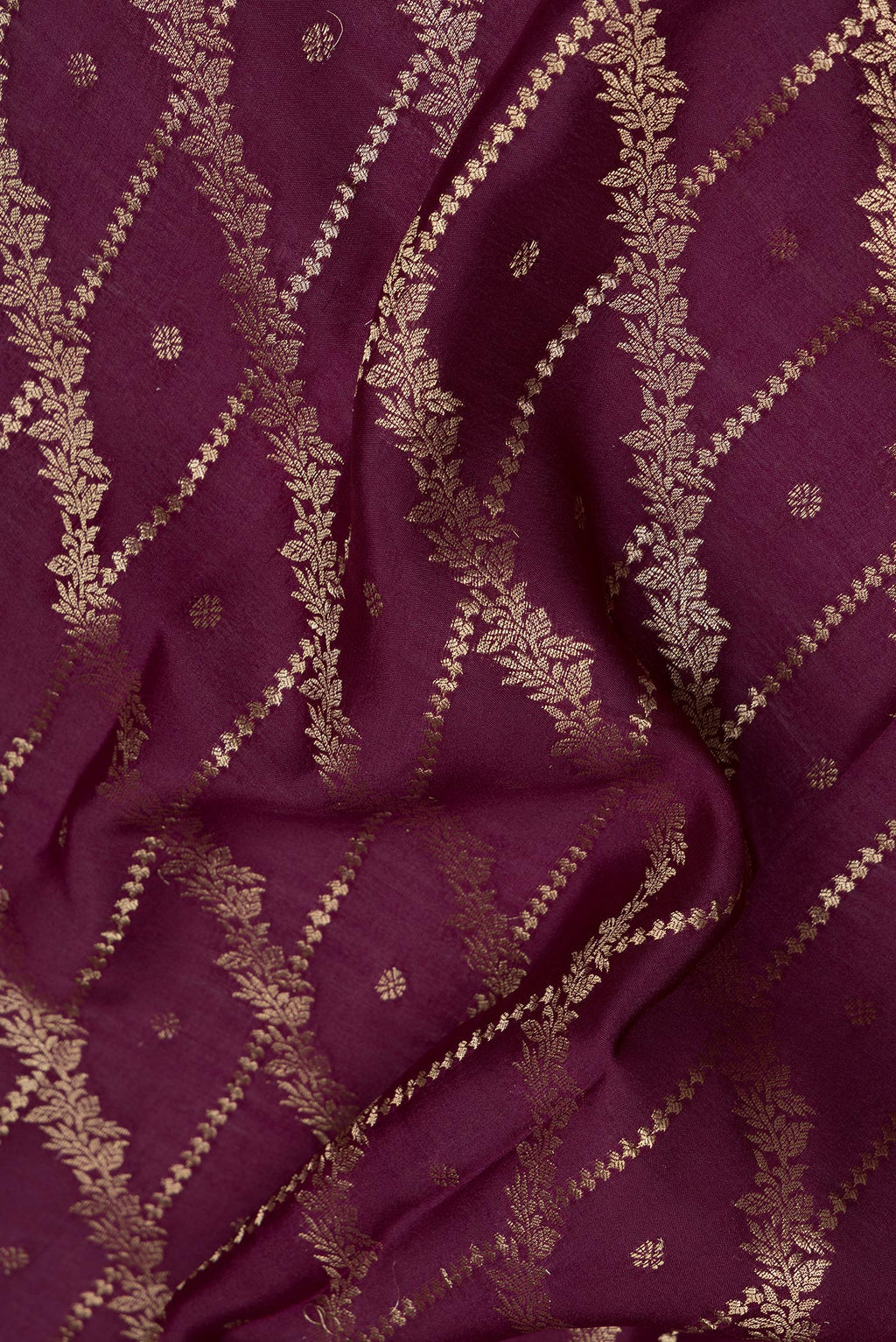 Close up of Burgundy Mysore Silk Saree with Zari Brocade on the body and Zari Border.  displaying folds