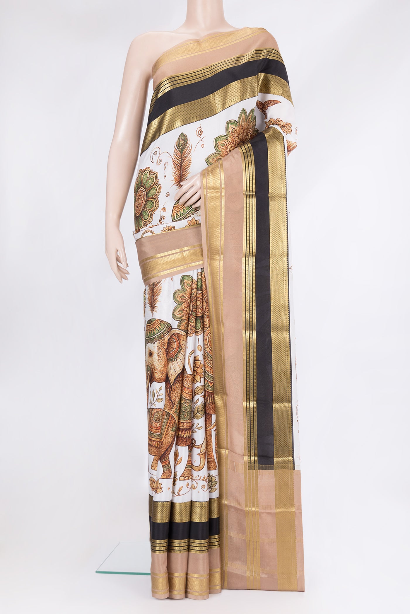 Off White Mysore Silk Saree with Printed design on the body and Fancy Border.  displayed on a mannequin