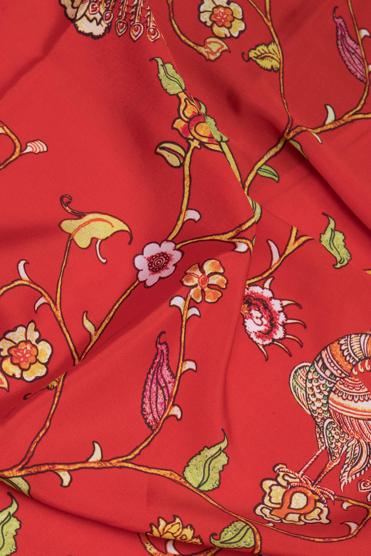 Close up of Red Mysore Silk Saree with Printed design on the body and Fancy Border.  displaying folds