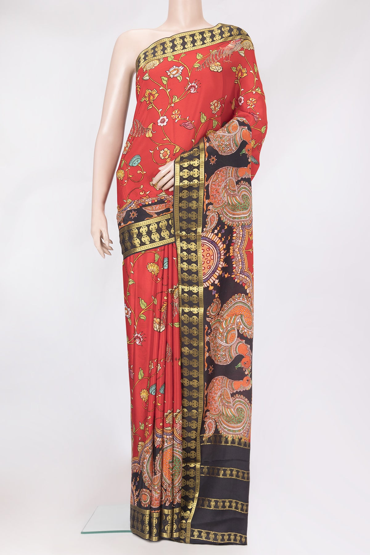 Red Mysore Silk Saree with Printed design on the body and Fancy Border.  displayed on a mannequin