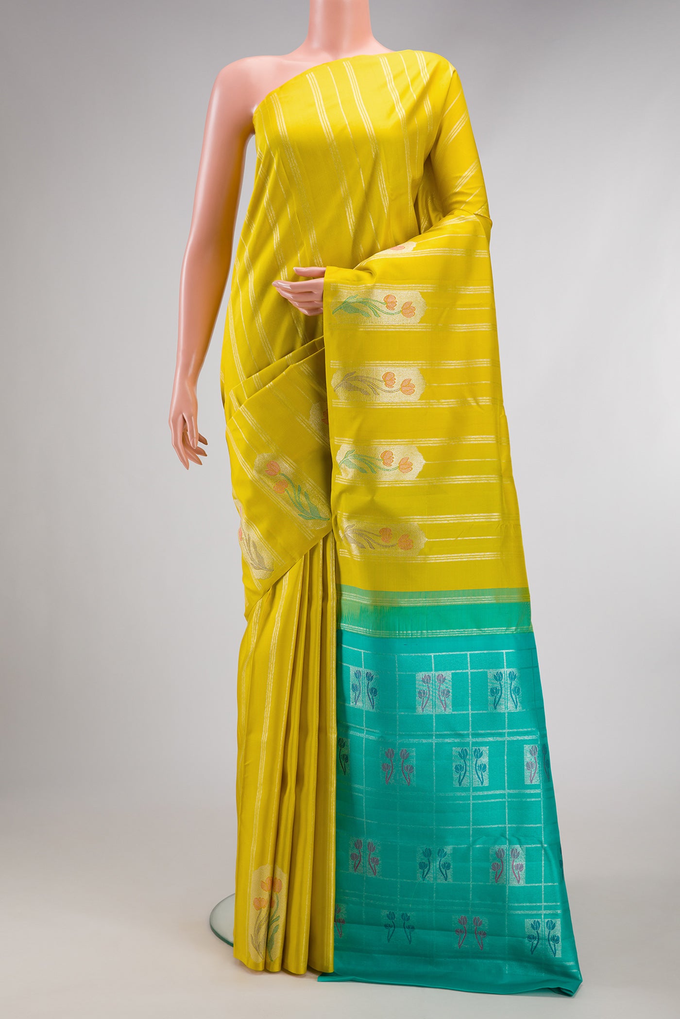 Lemon Yellow Kanjivaram Silk Saree with Stripes on the body and Without Border.  displayed on a mannequin