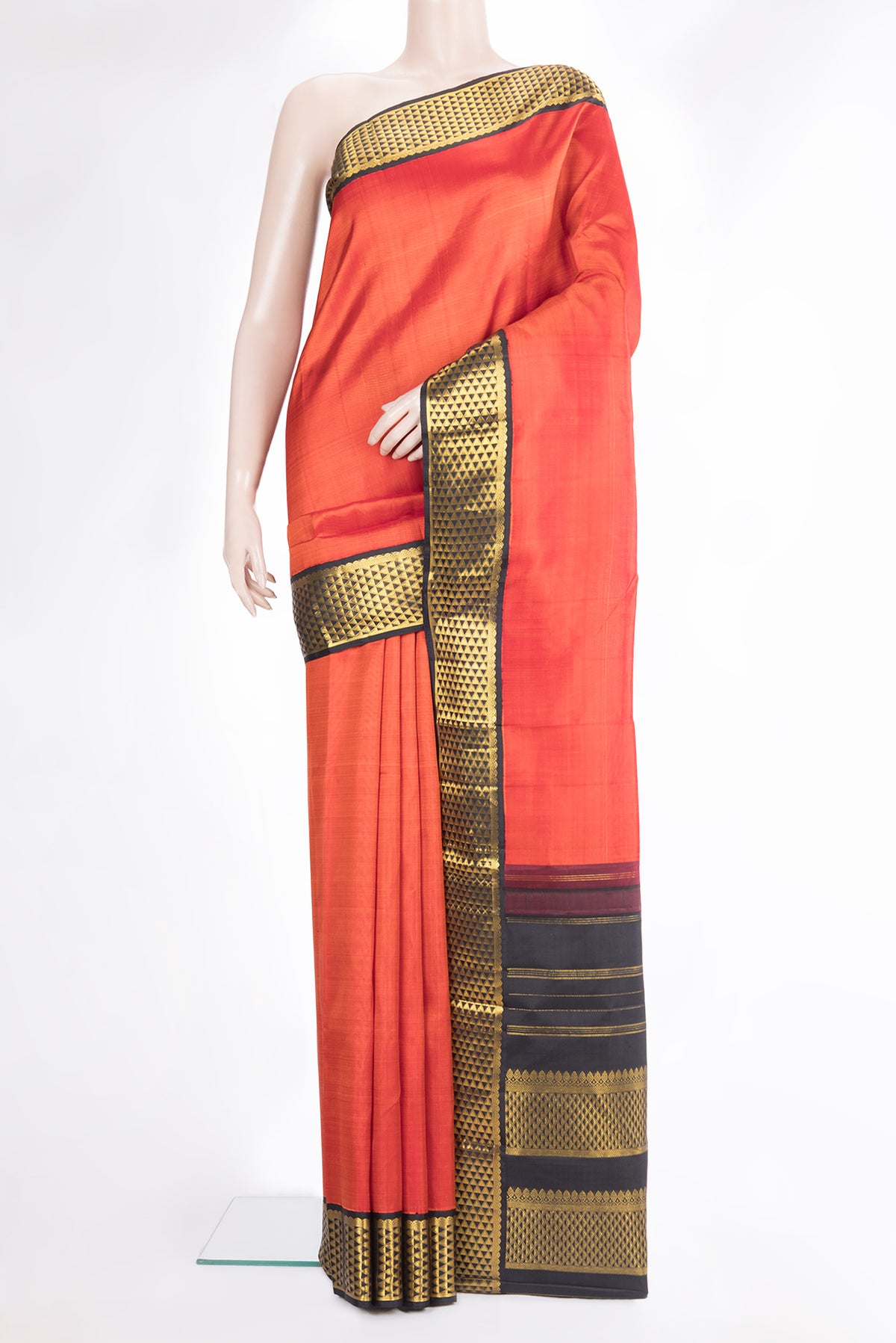 Pure Silk Orange Dual Tone Kanjivaram Saree with Plain Body and Zari Border.  displayed on a mannequin