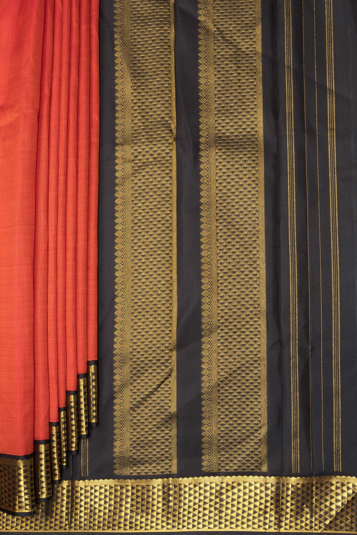 Pleats and pallu of Pure Silk Orange Dual Tone Kanjivaram Saree with Plain Body and Zari Border. 