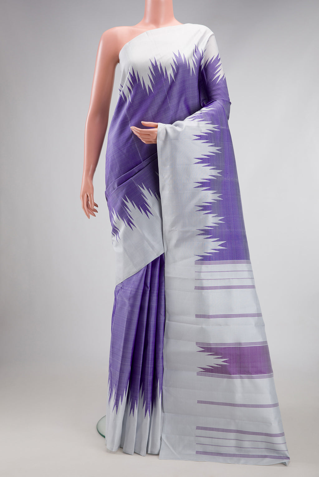 Violet Kanchipuram Silk Saree with Plain Body and Temple Border.  displayed on a mannequin