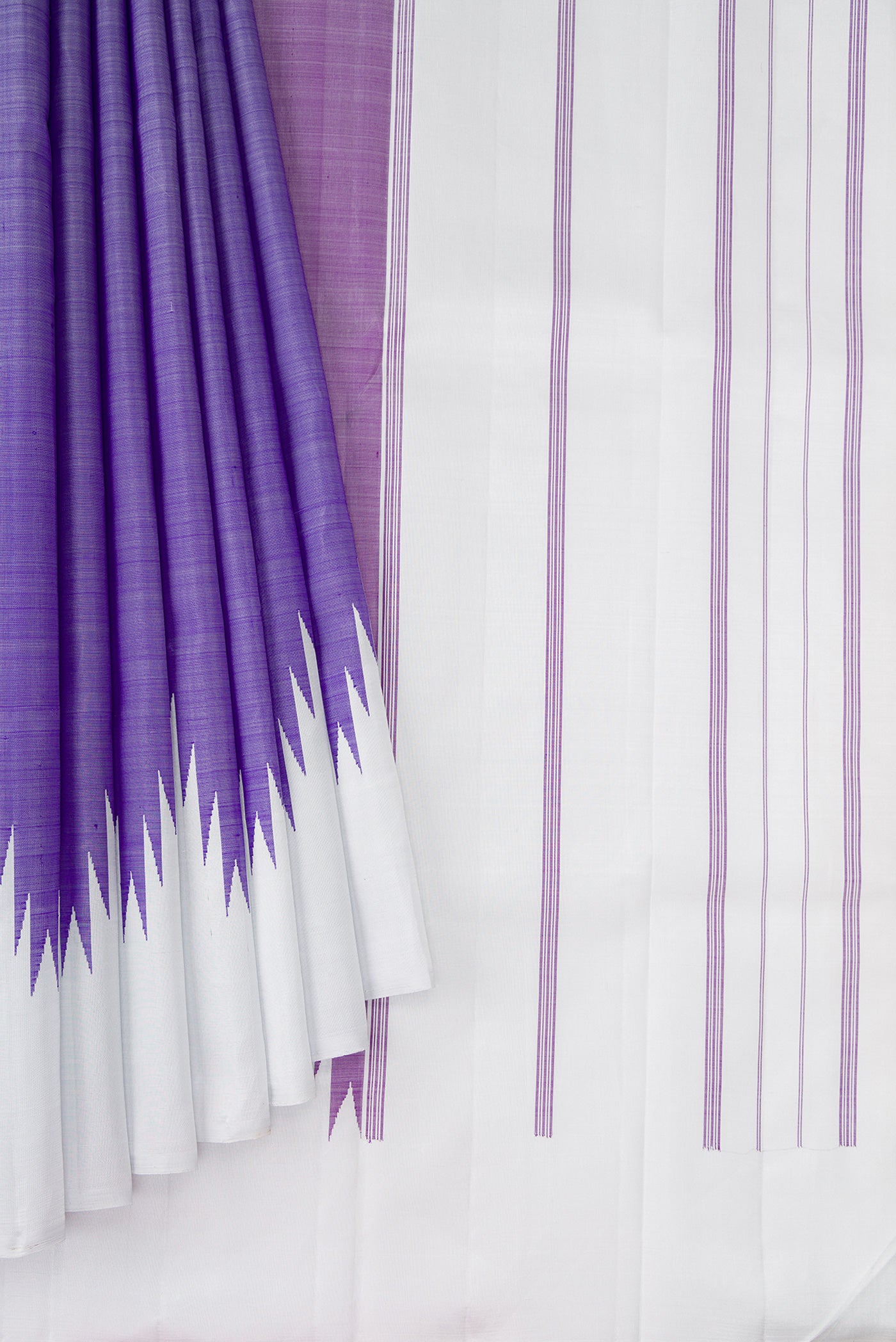 Pleats and pallu of Violet Kanchipuram Silk Saree with Plain Body and Temple Border. 