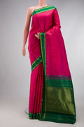 Pink Kanjivaram Silk Saree with Plain Body and Zari Border.  displayed on a mannequin