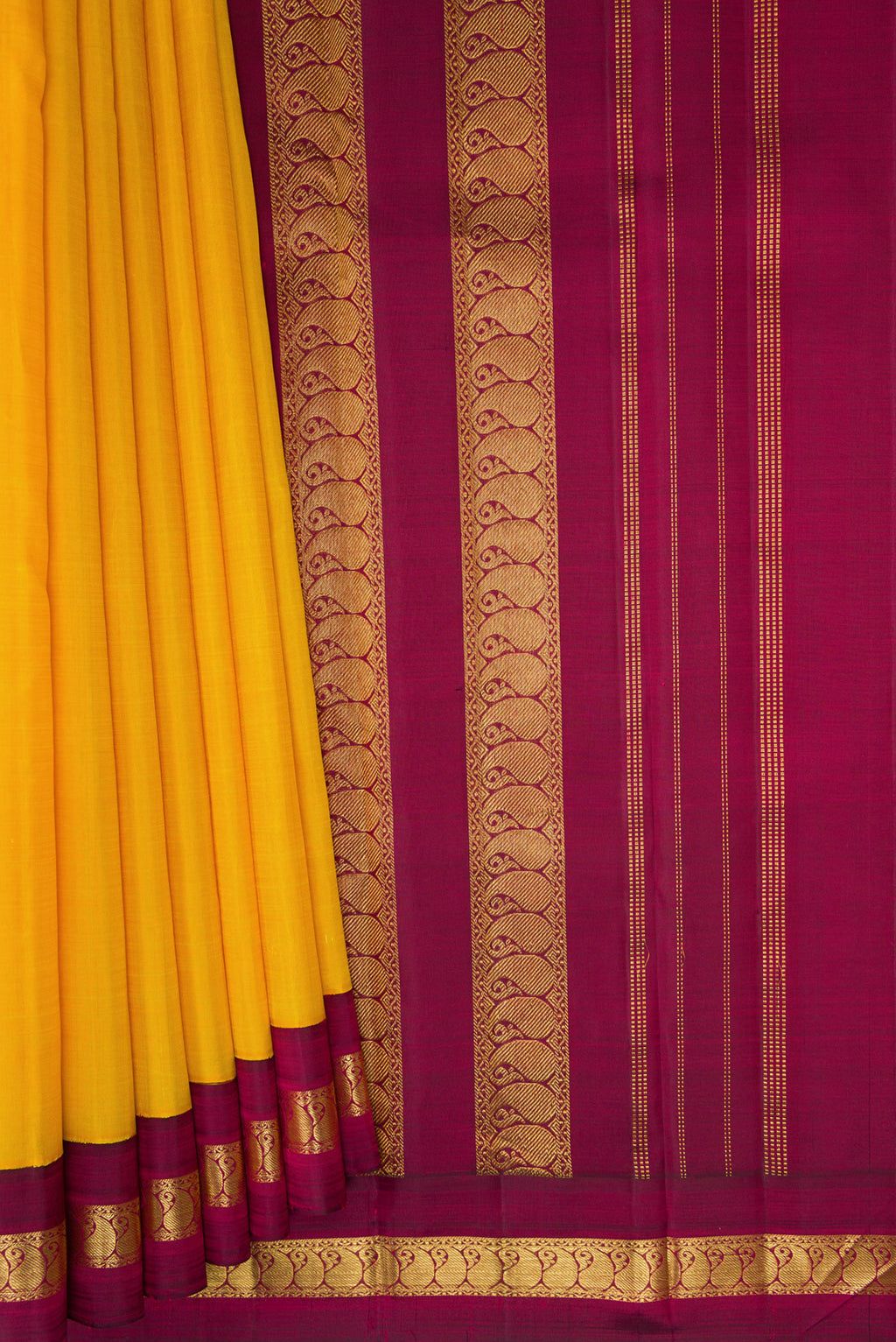 Pleats and pallu of Pure Silk Pure Zari Yellow Kanjivaram Saree with Plain Body and Zari Border. 