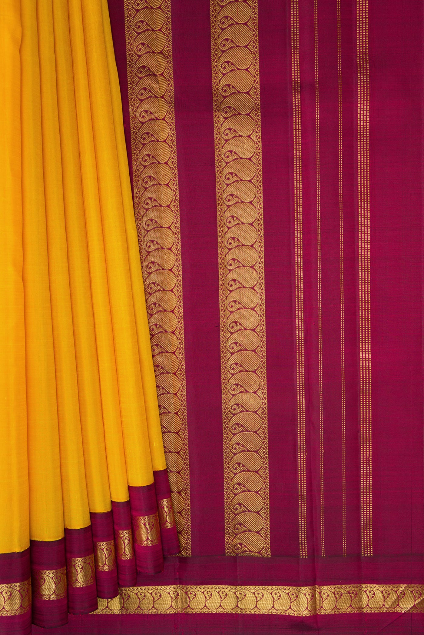 Pleats and pallu of Pure Silk Pure Zari Yellow Kanjivaram Saree with Plain Body and Zari Border. 