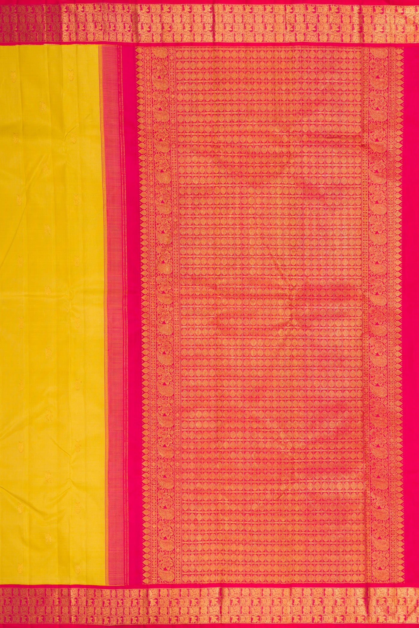 Close up image of the pallu of Yellow Kanjivaram Silk Saree with Zari Butta on the body and Zari Border. 