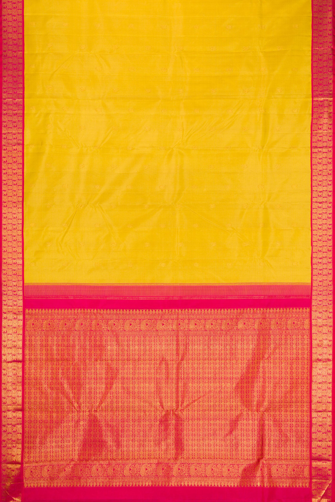 Flat view of Yellow Kanjivaram Silk Saree with Zari Butta on the body and Zari Border. 