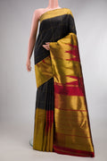 Pure Silk Black Kanchipuram Saree with Checked design on the body and Temple Border.  displayed on a mannequin