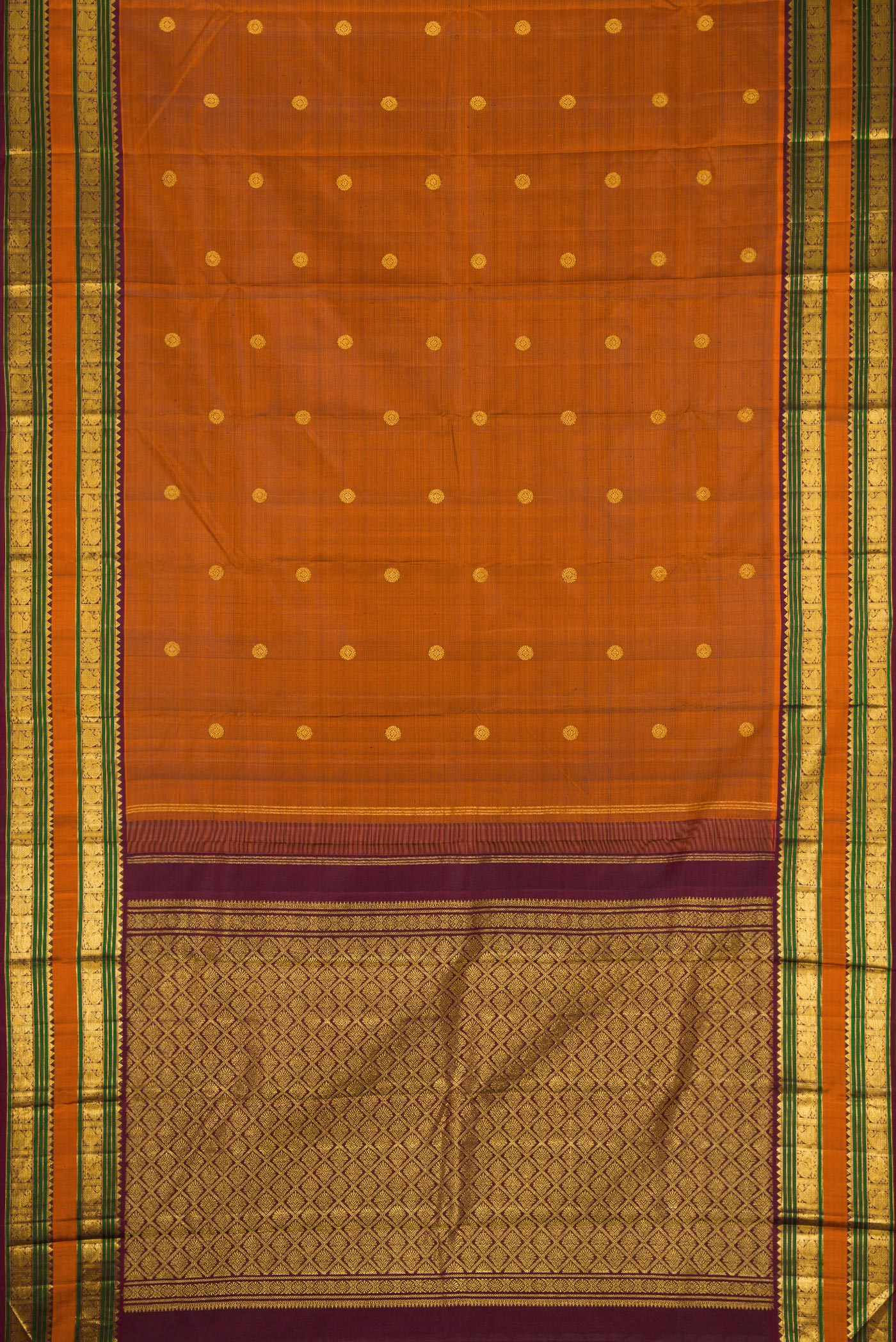 Flat view of Rust Kanjivaram Silk Saree with Zari Butta on the body and Zari Border. 