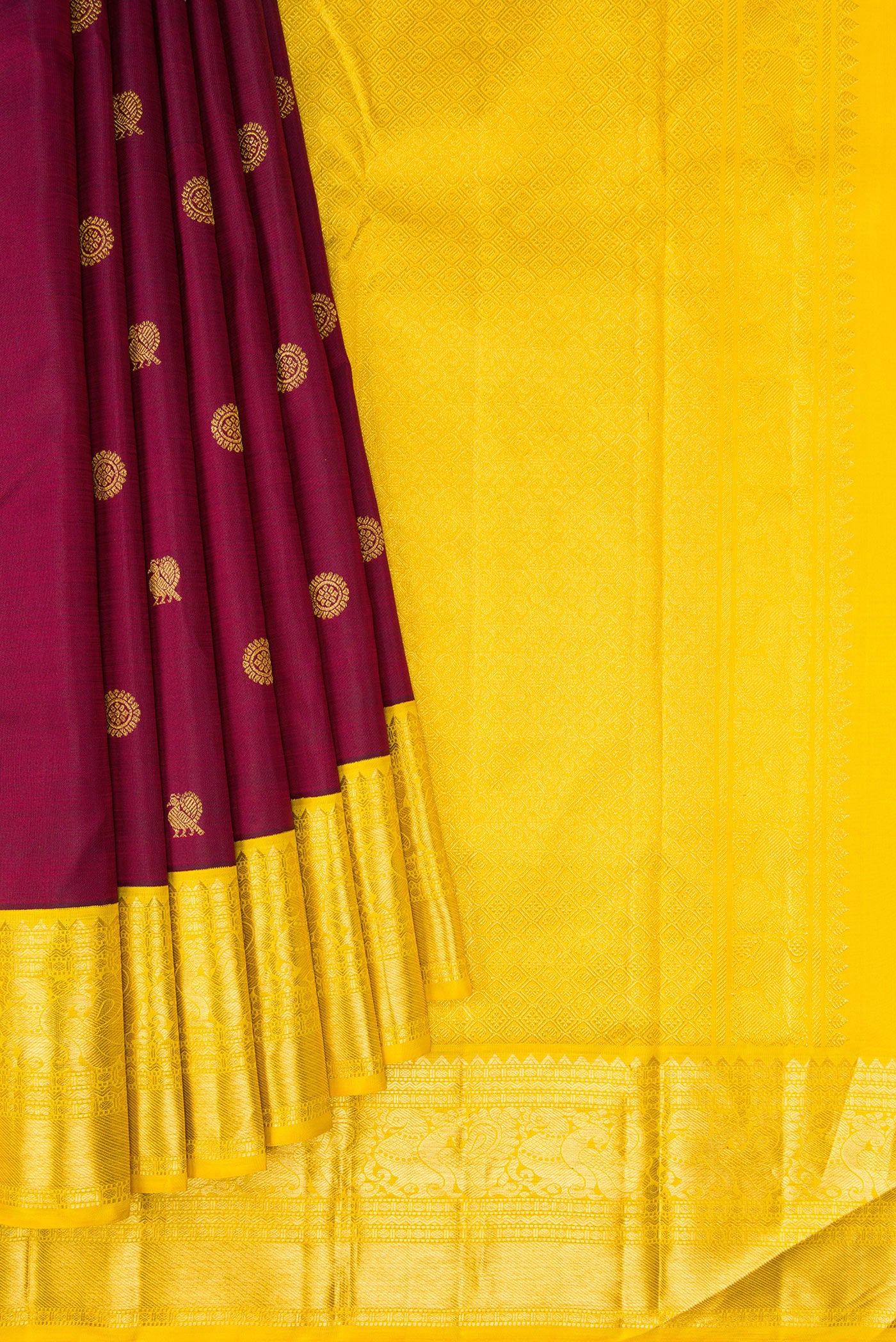 Pleats and pallu of Maroon Kanjivaram Silk Saree with Zari Butta on the body and Zari Border. 