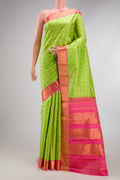 Parrot Green Kanchipuram Silk Saree with Checked design on the body and Zari Border.  displayed on a mannequin