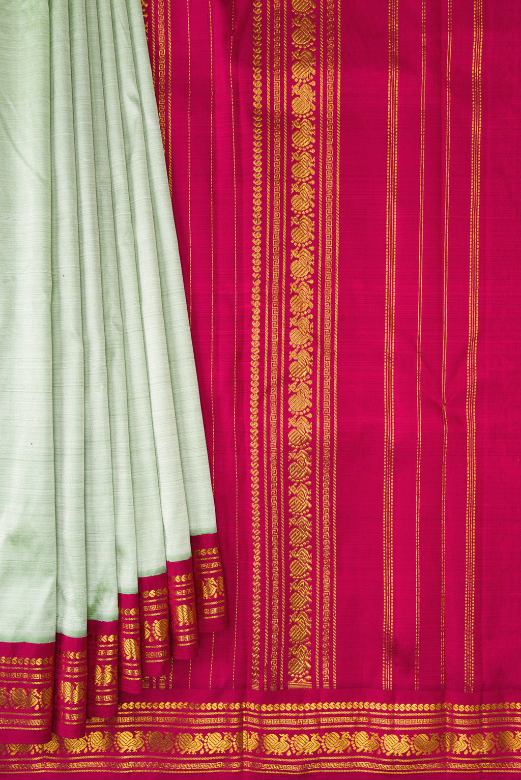 Pleats and pallu of Pista Green Kanchipuram Silk Saree with Plain Body and Zari Border. 