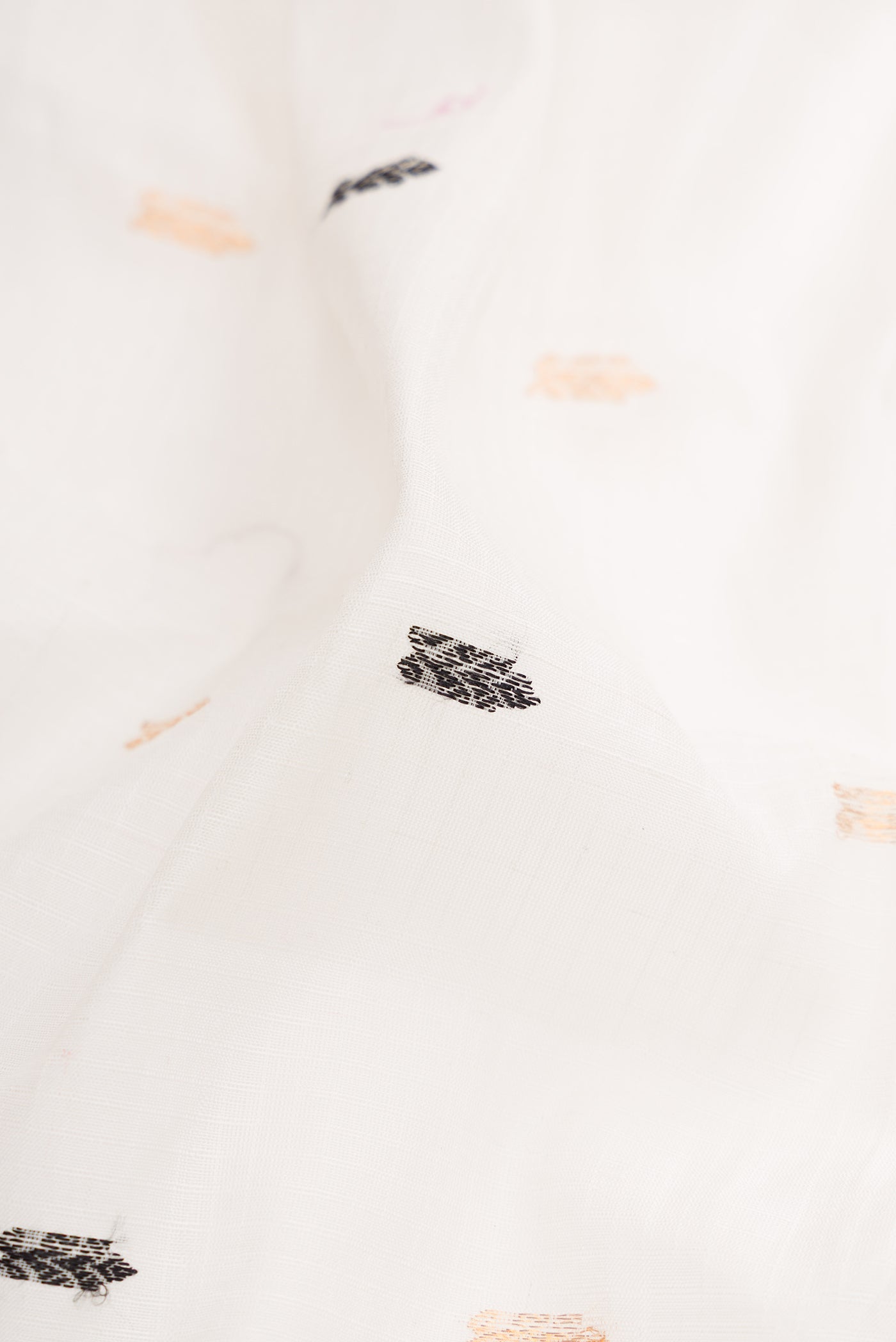Close up of White Gadwal Silk Cotton Saree with Checked design on the body and Zari Border.  displaying folds