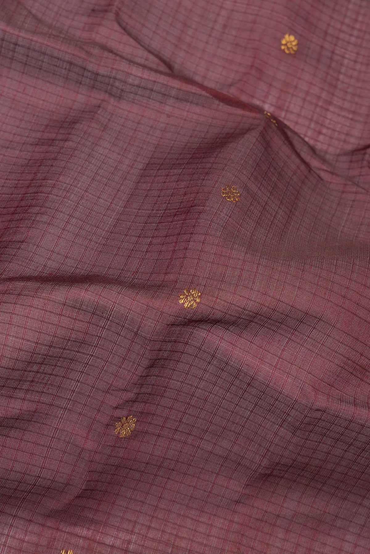Close up of Pure Silk Maroon Dual Tone Gadwal Saree with Checked design on the body and Zari Border.  displaying folds