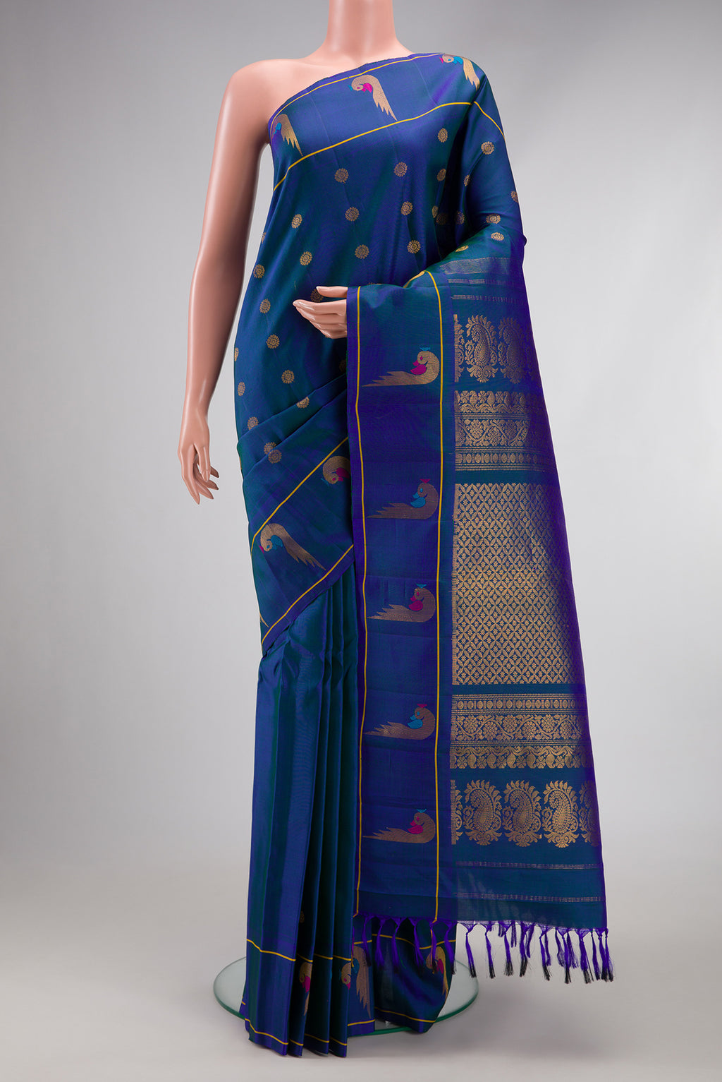 Peacock Blue Dual Tone Gadwal Silk Saree with Zari Butta on the body and Paithani Border.  displayed on a mannequin