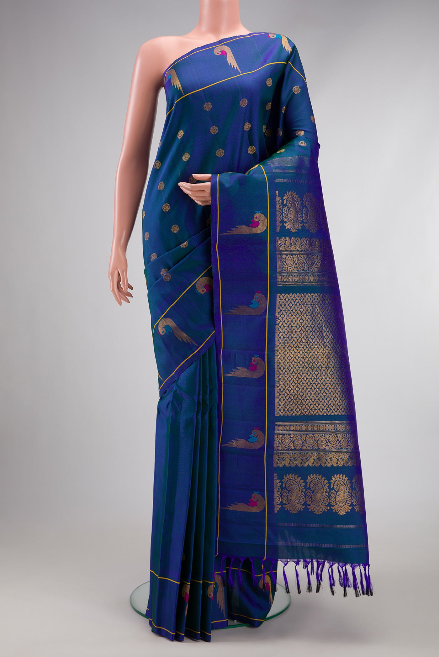 Peacock Blue Dual Tone Gadwal Silk Saree with Zari Butta on the body and Paithani Border.  displayed on a mannequin