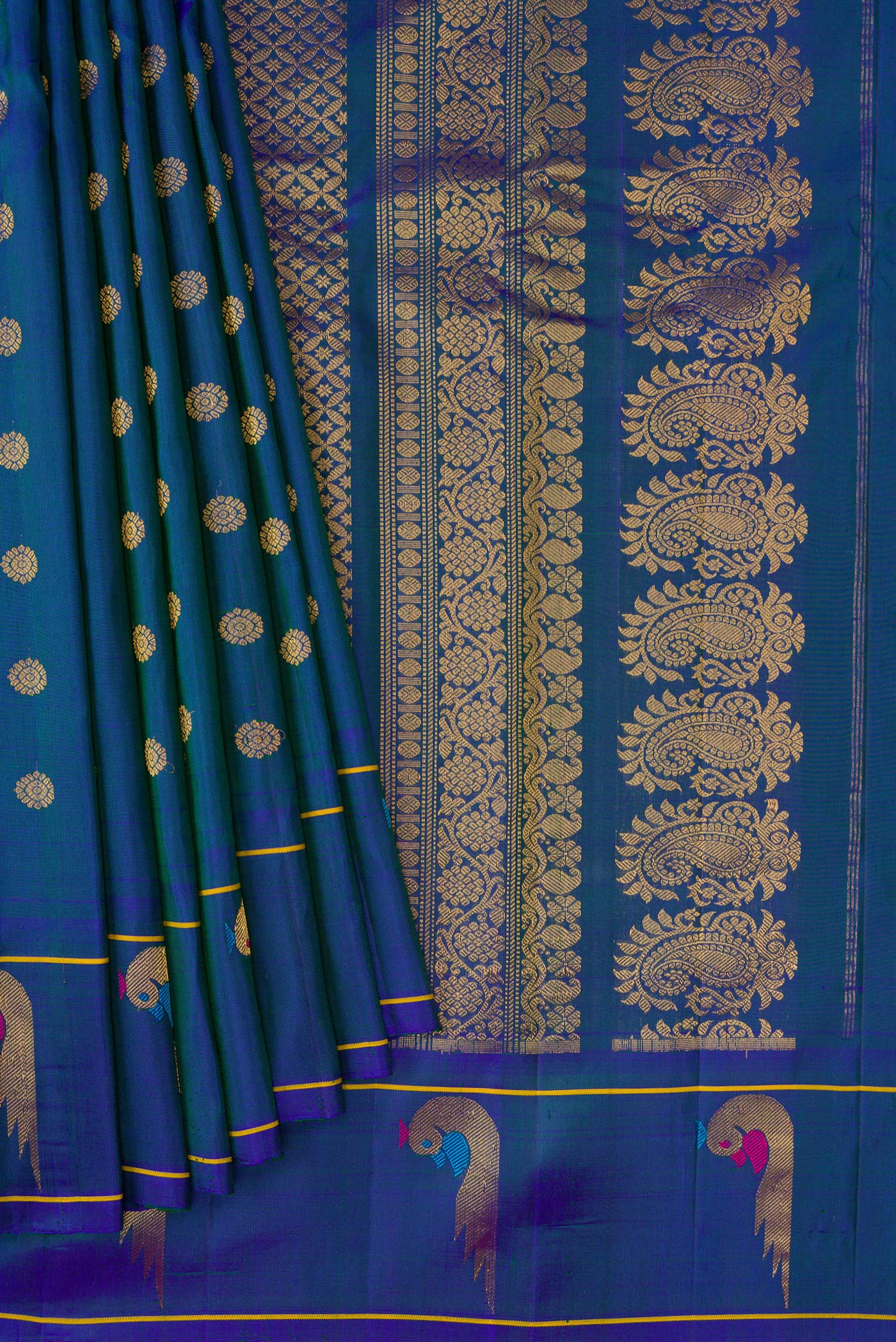 Pleats and pallu of Peacock Blue Dual Tone Gadwal Silk Saree with Zari Butta on the body and Paithani Border. 