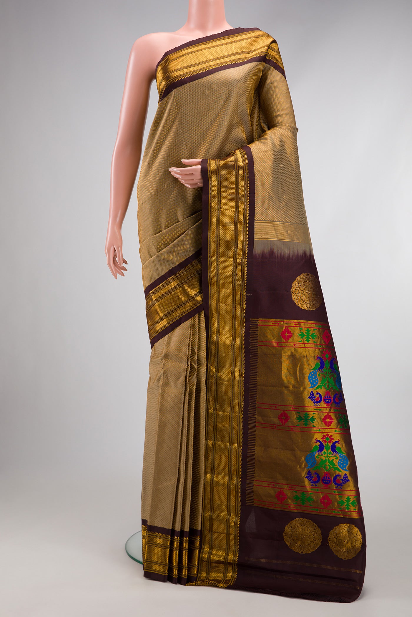 Dark Beige Gadwal Silk Saree with Zari Brocade on the body and Zari Border.  displayed on a mannequin