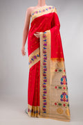 Red Gadwal Silk Saree with Zari Butta on the body and Paithani Border.  displayed on a mannequin