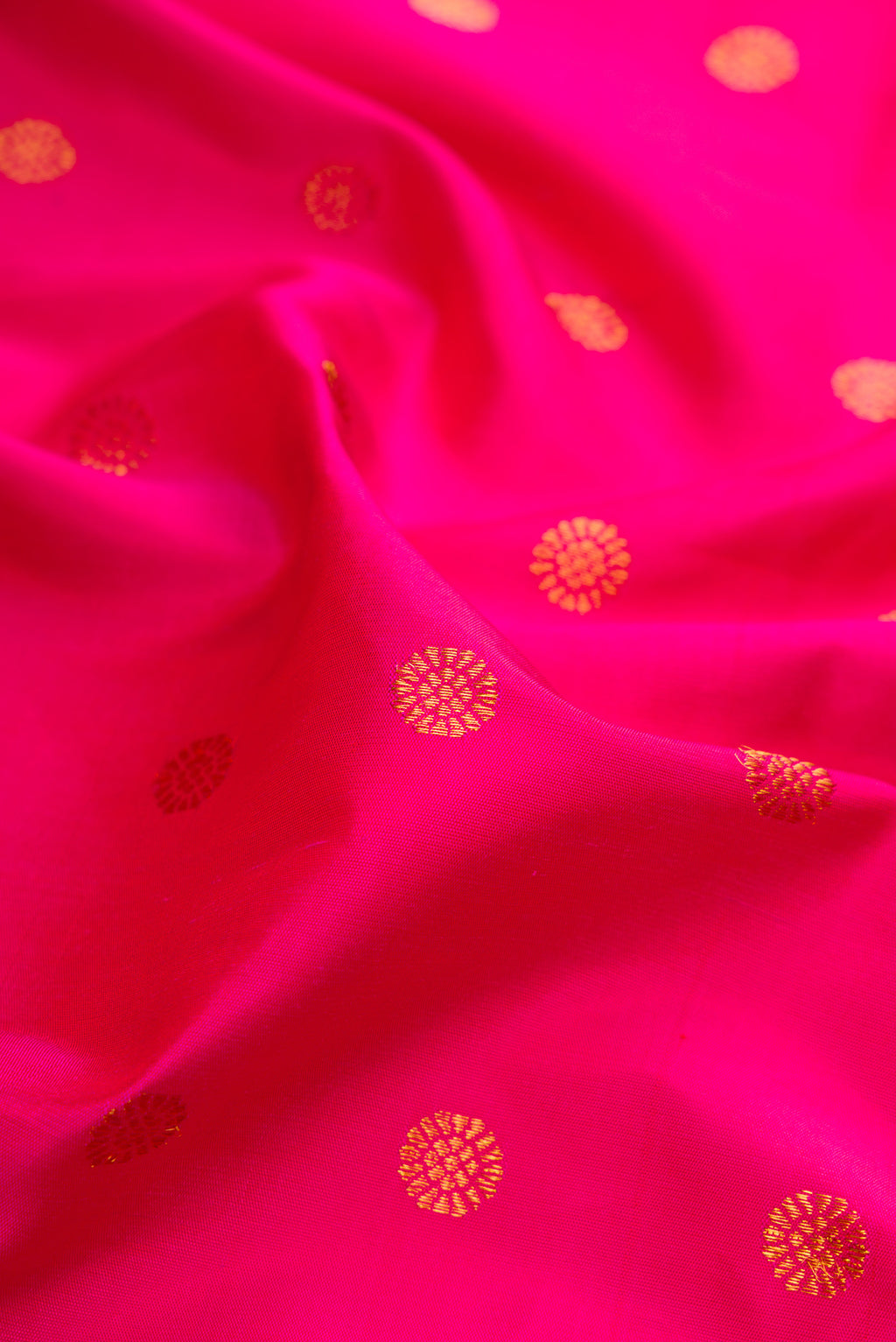 Close up of Pink Gadwal Silk Saree with Zari Butta on the body and Paithani Border.  displaying folds
