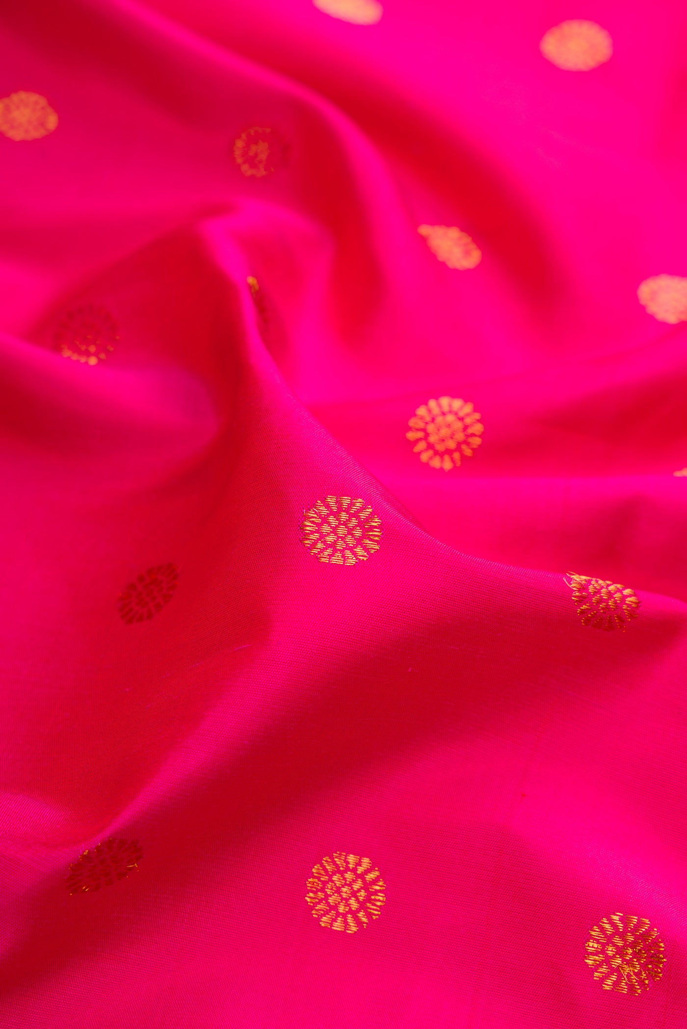 Close up of Pink Gadwal Silk Saree with Zari Butta on the body and Paithani Border.  displaying folds