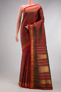 Mehandi Green Dual Tone Kanjivaram Silk Saree with Zari Butta on the body and Zari Border.  displayed on a mannequin