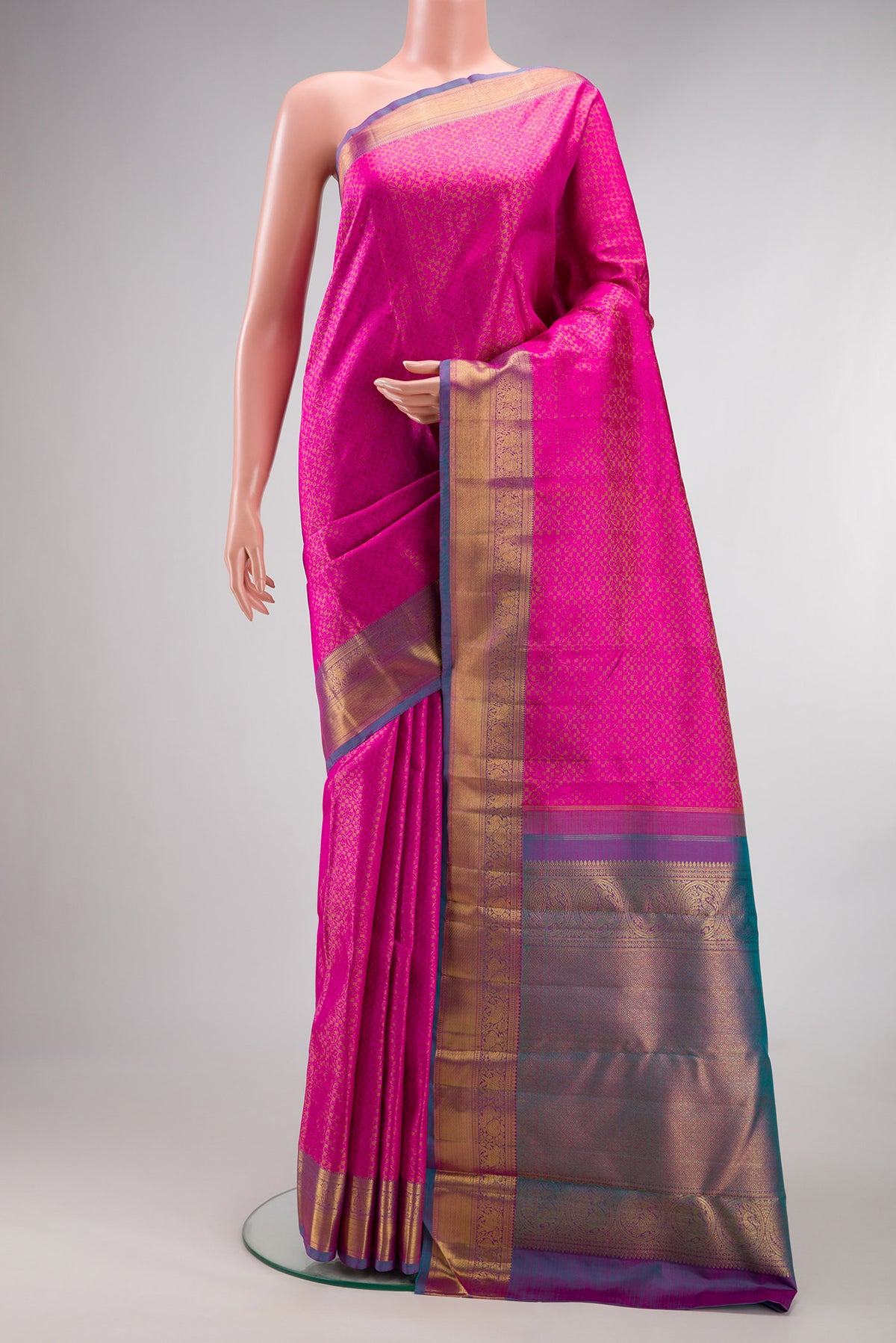 Pure Silk Pink Dual Tone Kanjivaram Saree with Jacquard design on the body and Zari Border.  displayed on a mannequin