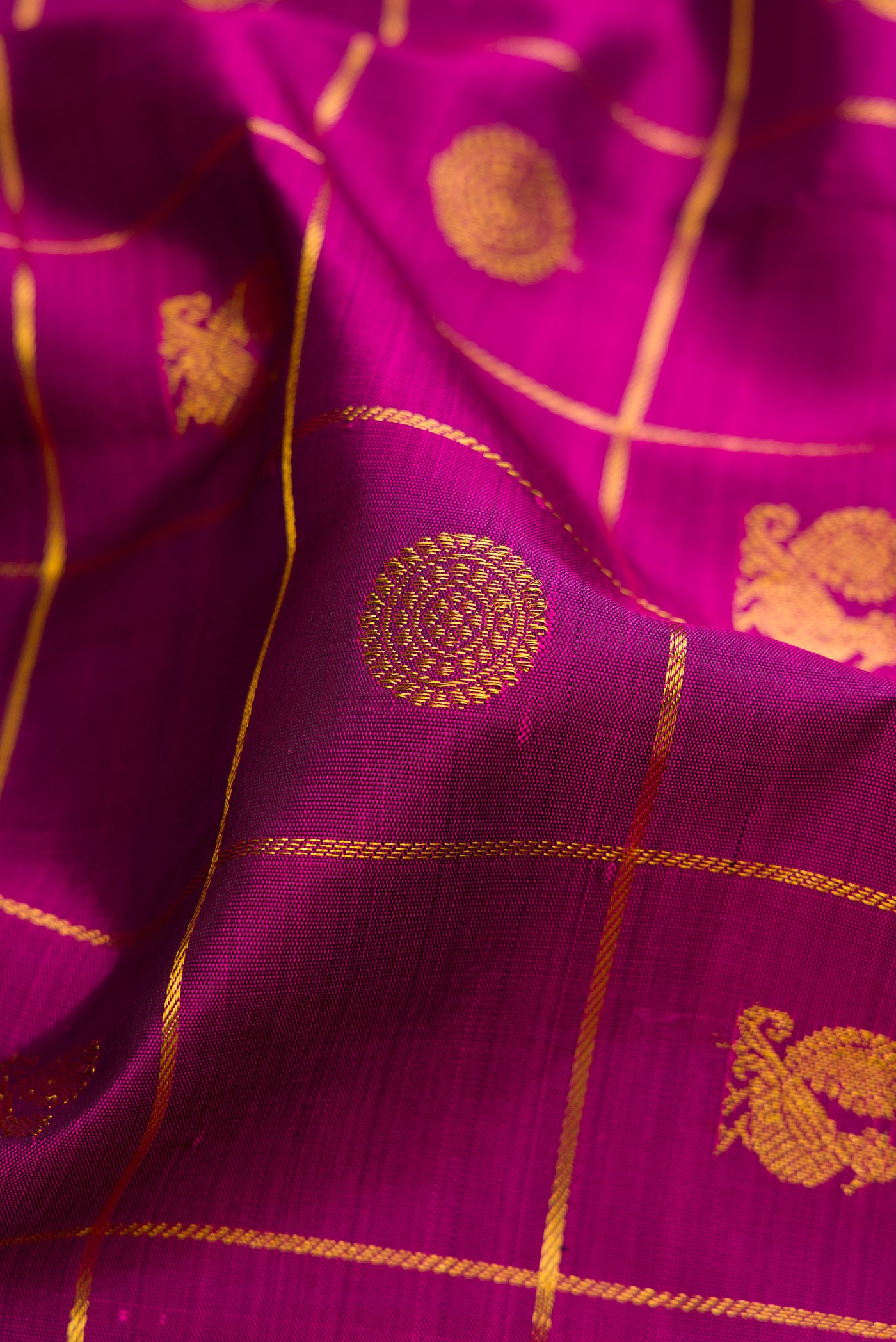 Close up of Purple Kanchipuram Silk Nine Yards Saree with Checked design on the body and Zari Border.  displaying folds