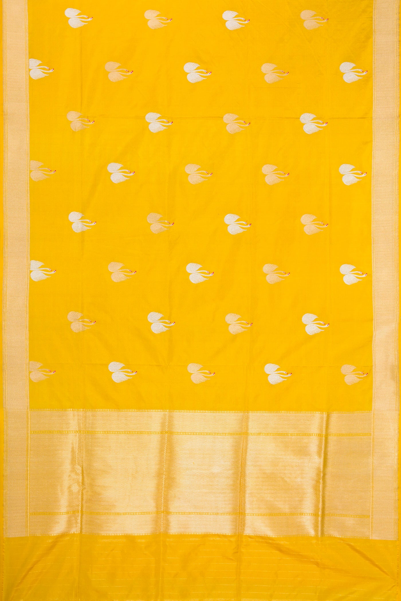 Flat view of Yellow Dual Tone Banarasi Silk Saree with Zari And Thread Butta on the body and Zari Border. 