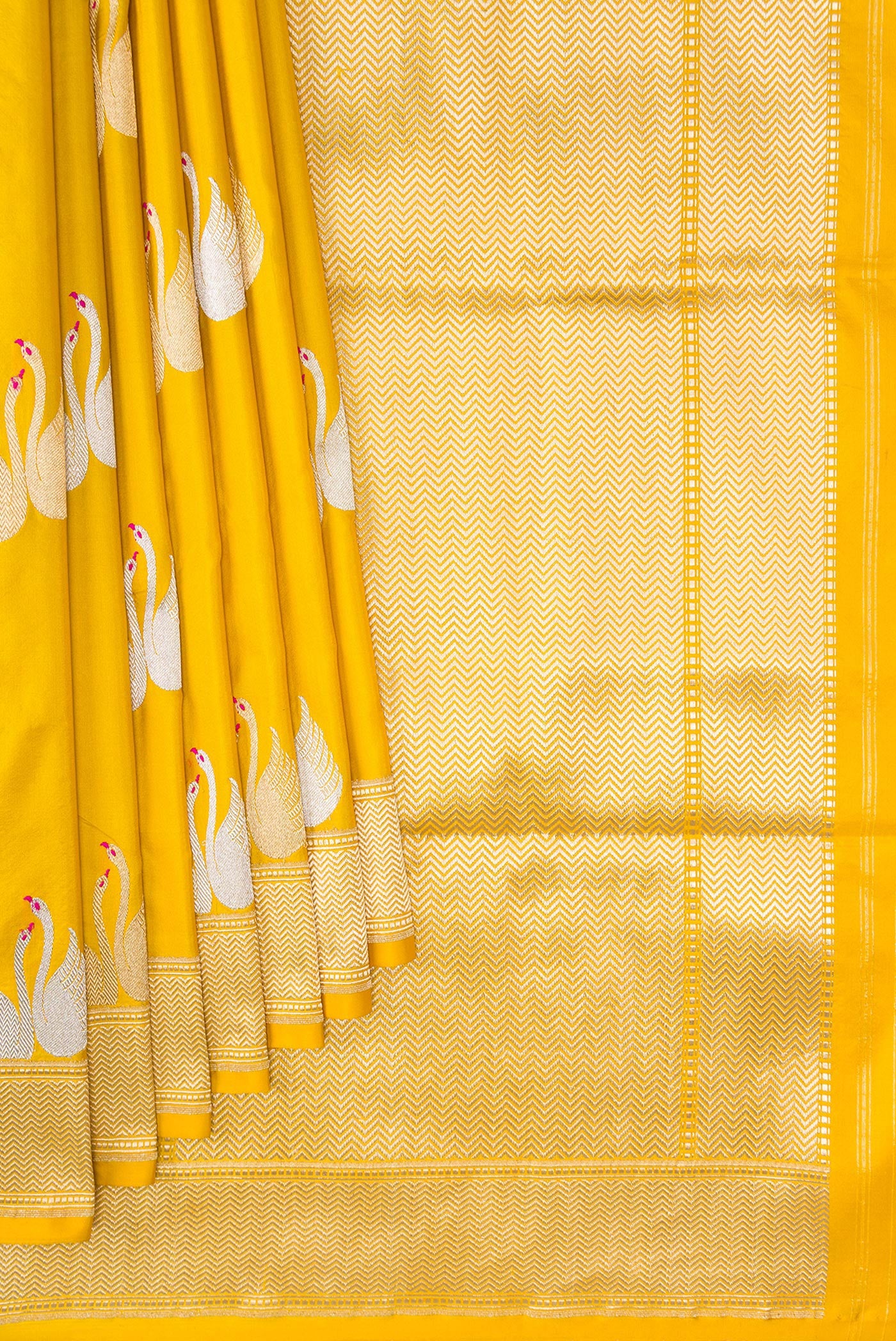 Pleats and pallu of Yellow Dual Tone Banarasi Silk Saree with Zari And Thread Butta on the body and Zari Border. 