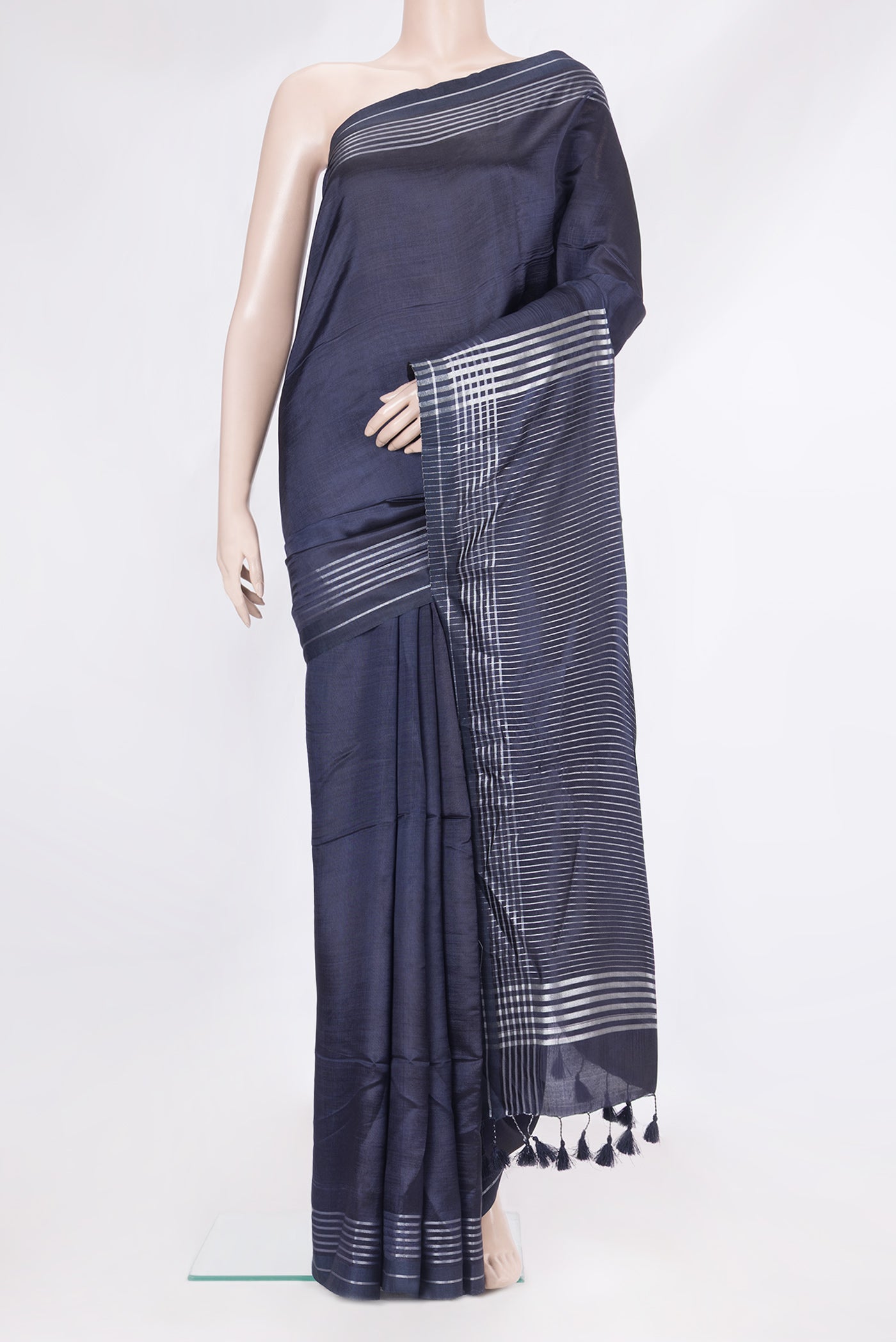 Navy Blue Blended Tussar Silk Saree with Plain Body and Plain Border.  displayed on a mannequin