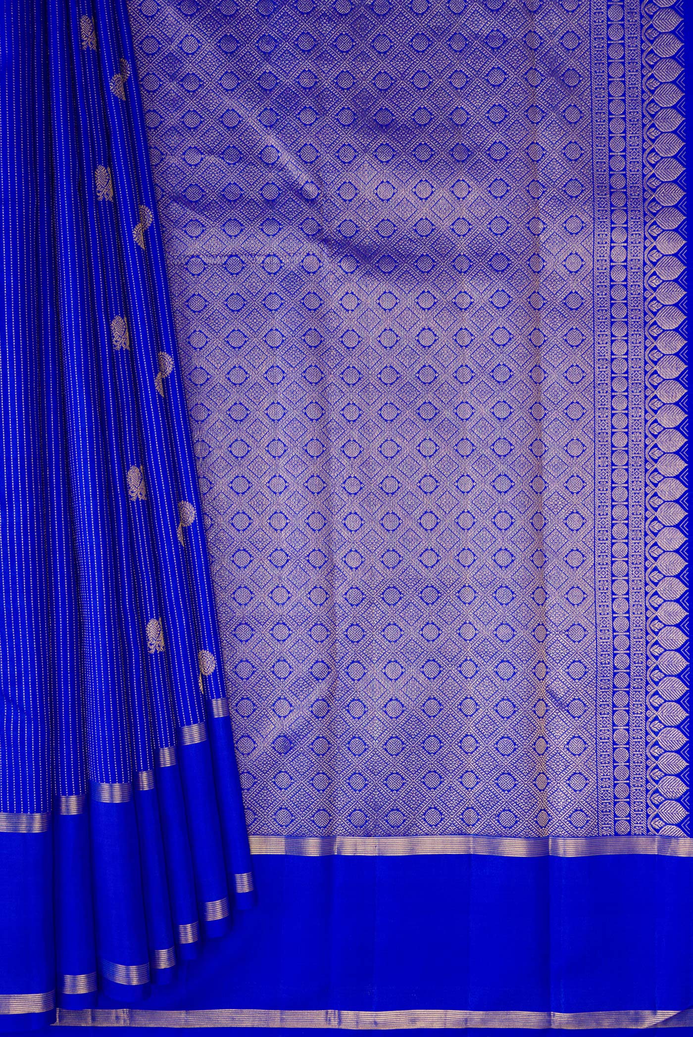 Pleats and pallu of Royal Blue Kanchipuram Silk Saree with Stripes on the body and Zari Border. 