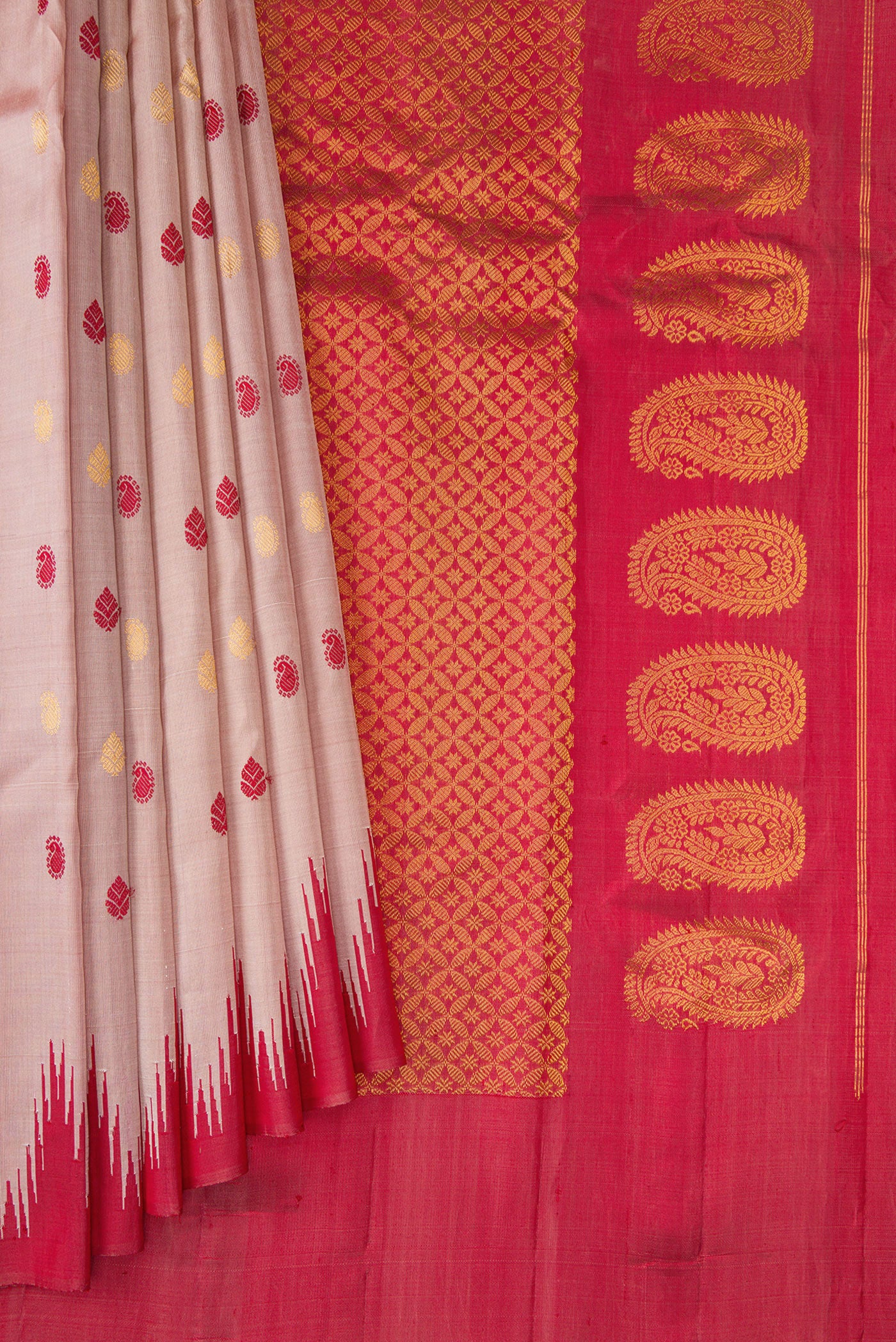 Pleats and pallu of Rose Gold Gadwal Silk Saree with Zari And Thread Butta on the body and Temple Border. 