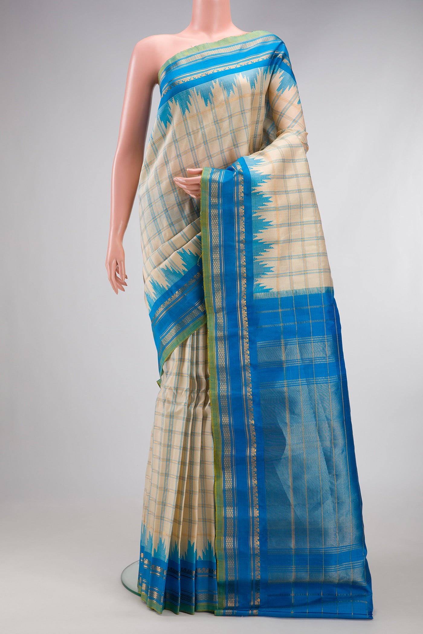 Beige Gadwal Silk Saree with Checked design on the body and Zari Border.  displayed on a mannequin
