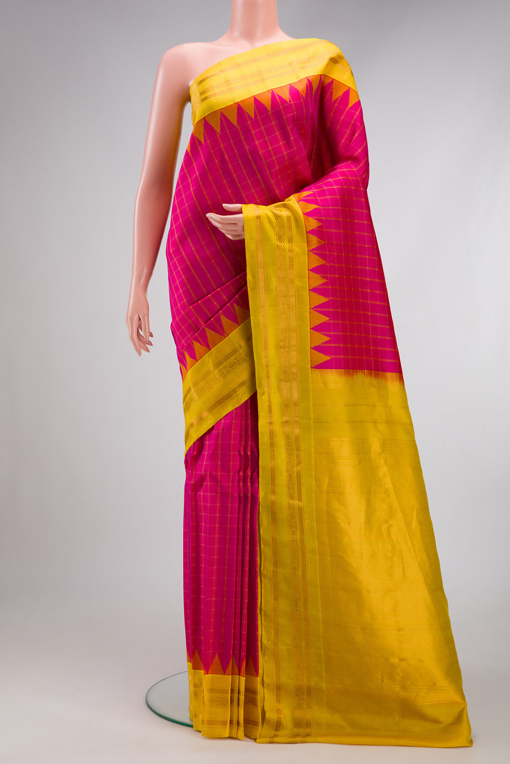 Pink Gadwal Silk Saree with Checked design on the body and Zari Border.  displayed on a mannequin