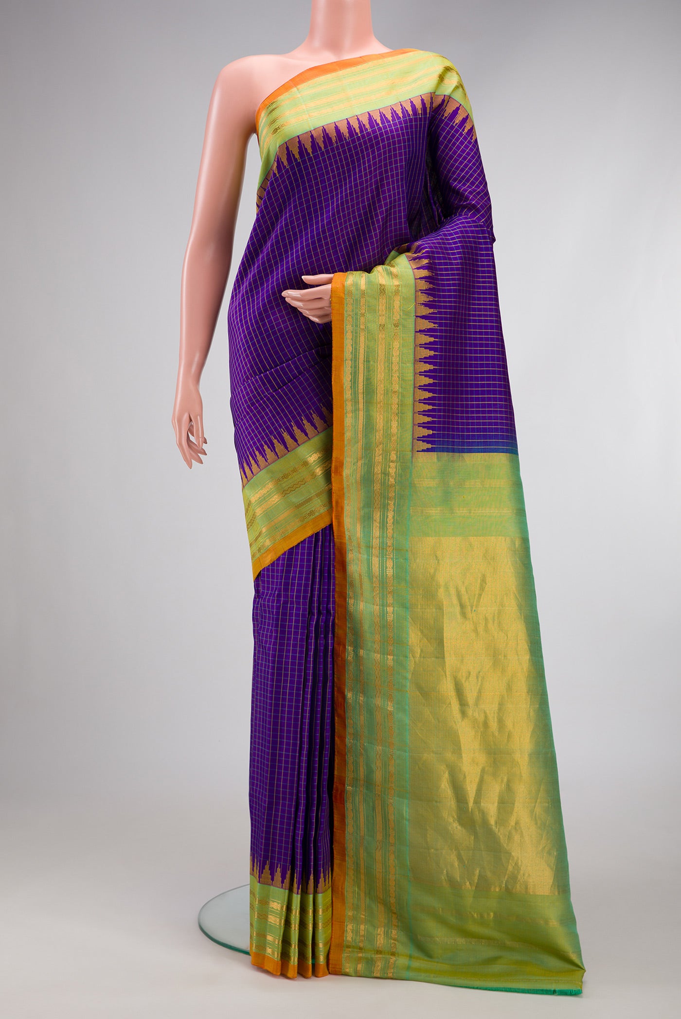 Dark Blue Gadwal Silk Saree with Checked design on the body and Zari Border.  displayed on a mannequin