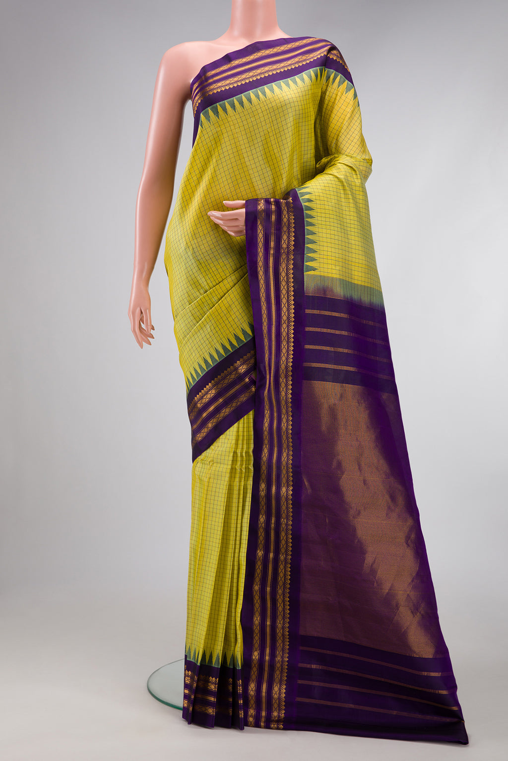 Light Green Gadwal Silk Saree with Checked design on the body and Zari Border.  displayed on a mannequin