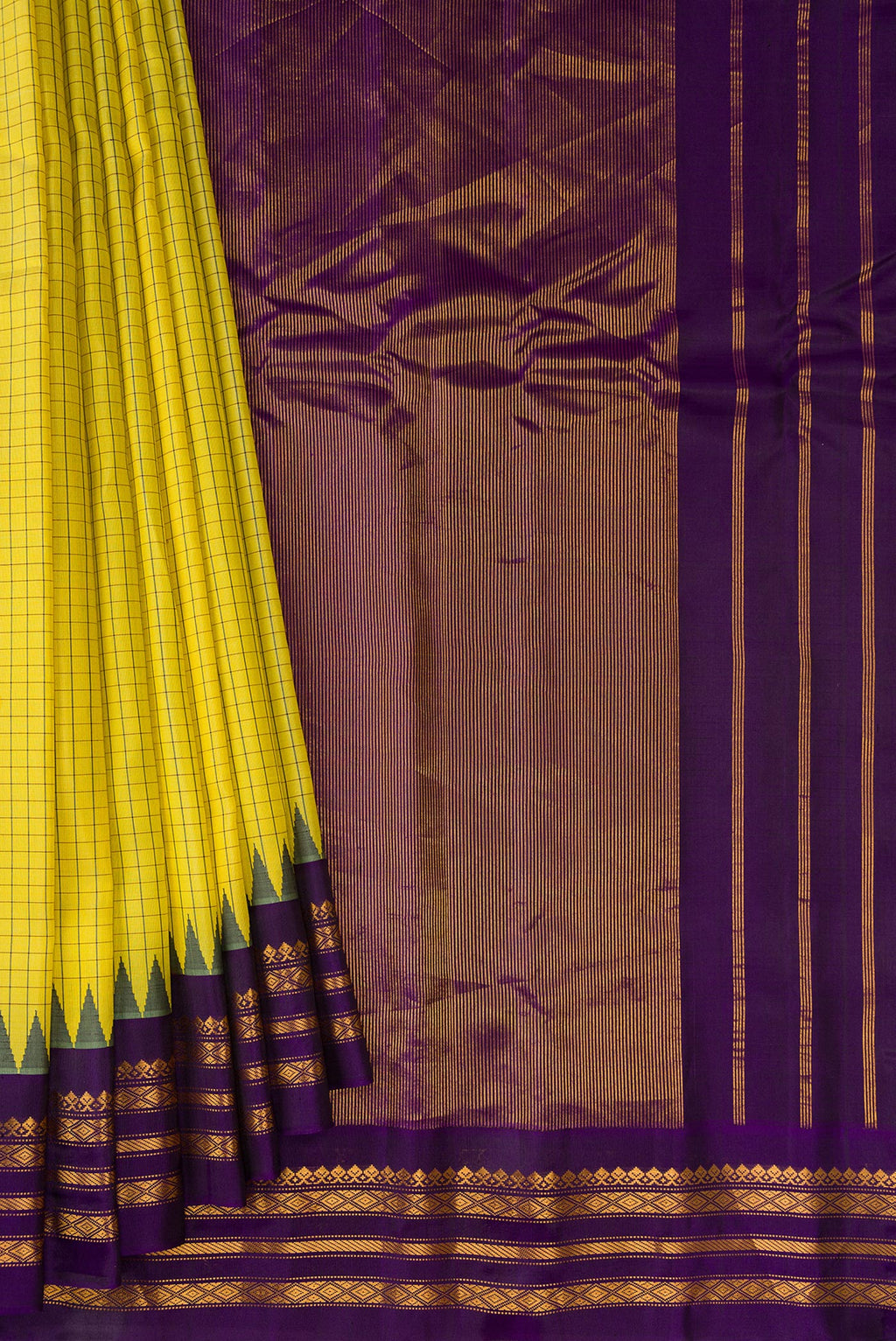 Pleats and pallu of Light Green Gadwal Silk Saree with Checked design on the body and Zari Border. 