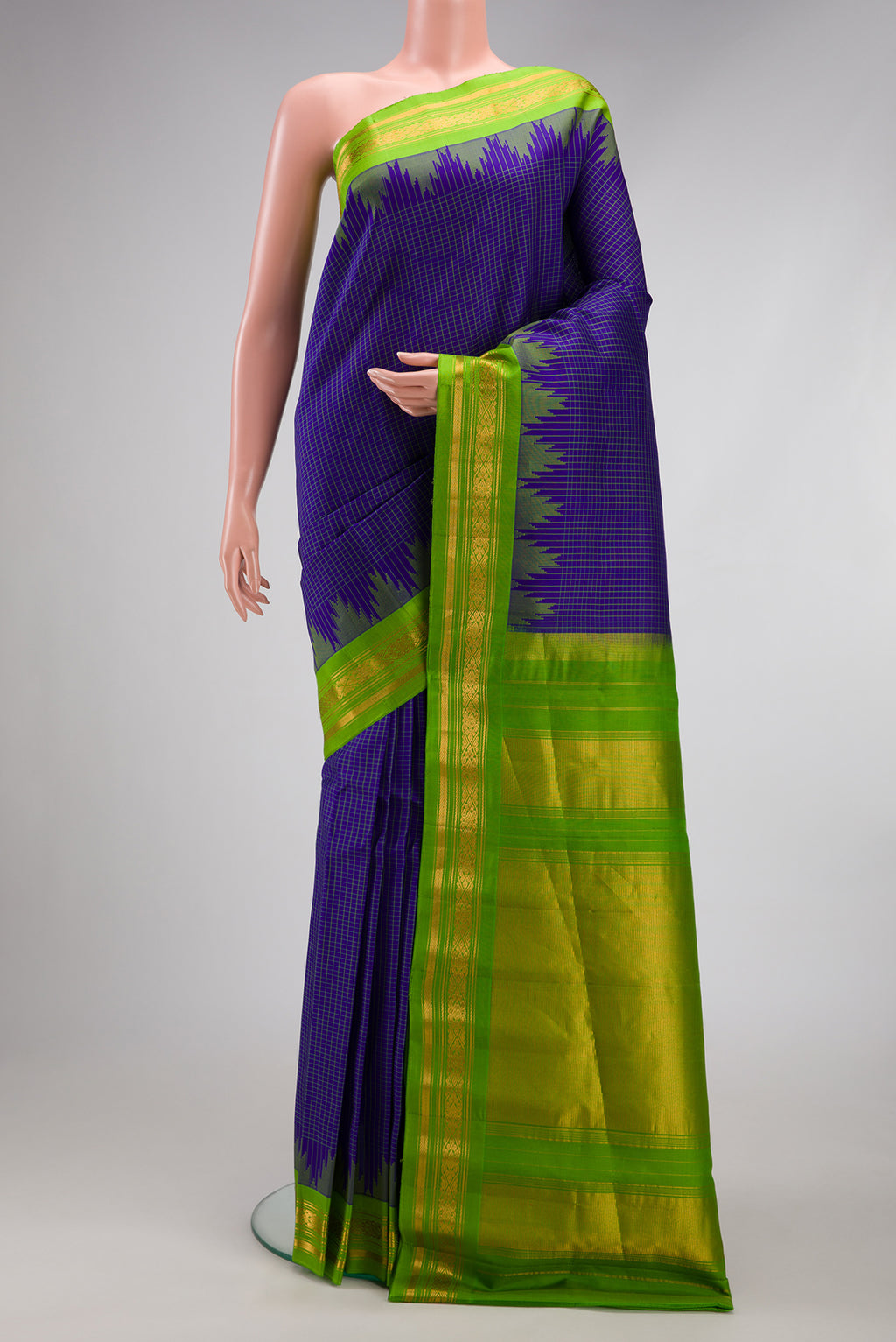 Royal Blue Gadwal Silk Saree with Checked design on the body and Temple Border.  displayed on a mannequin