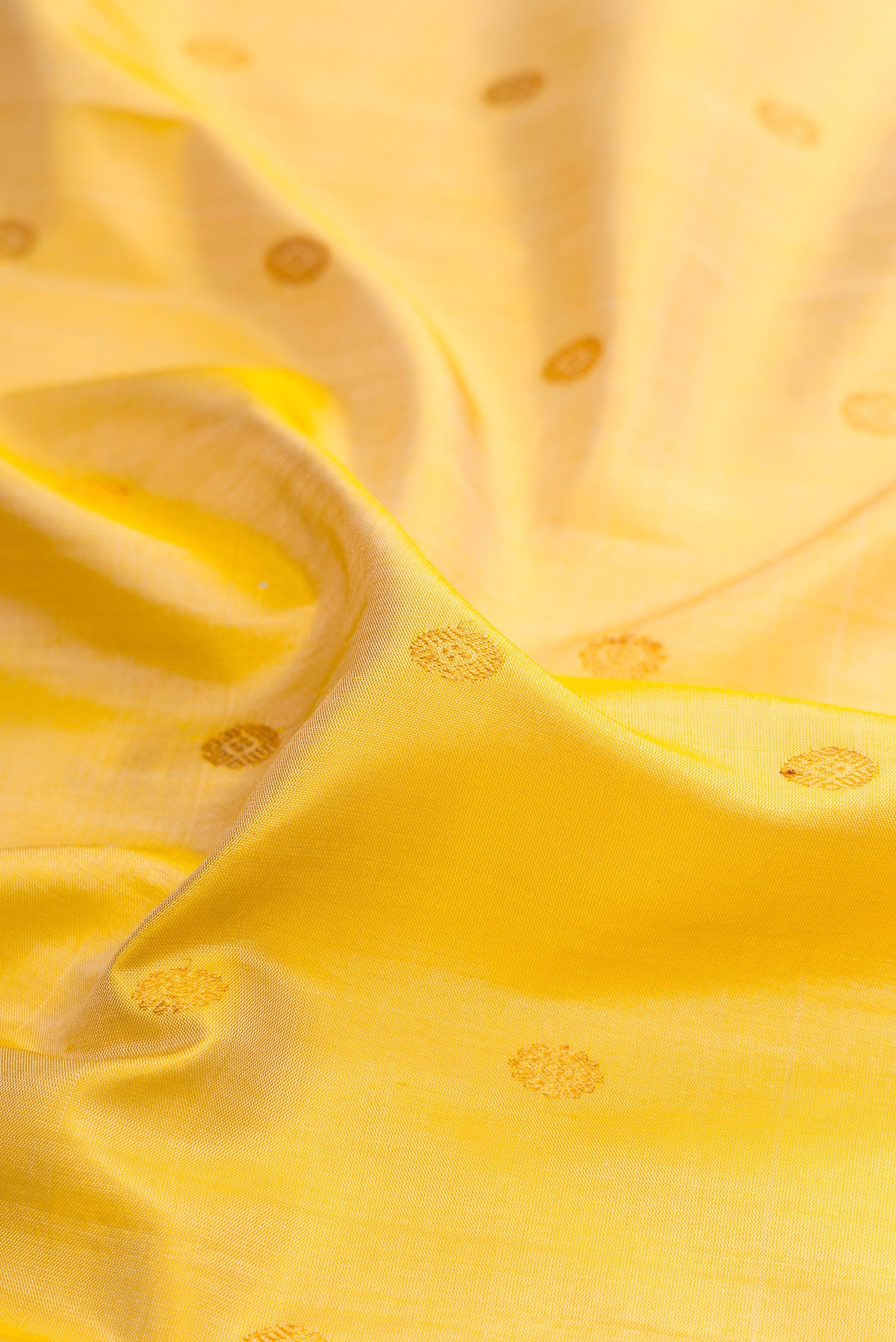 Close up of Sandal Gadwal Silk Saree with Zari Butta on the body and Zari Border.  displaying folds