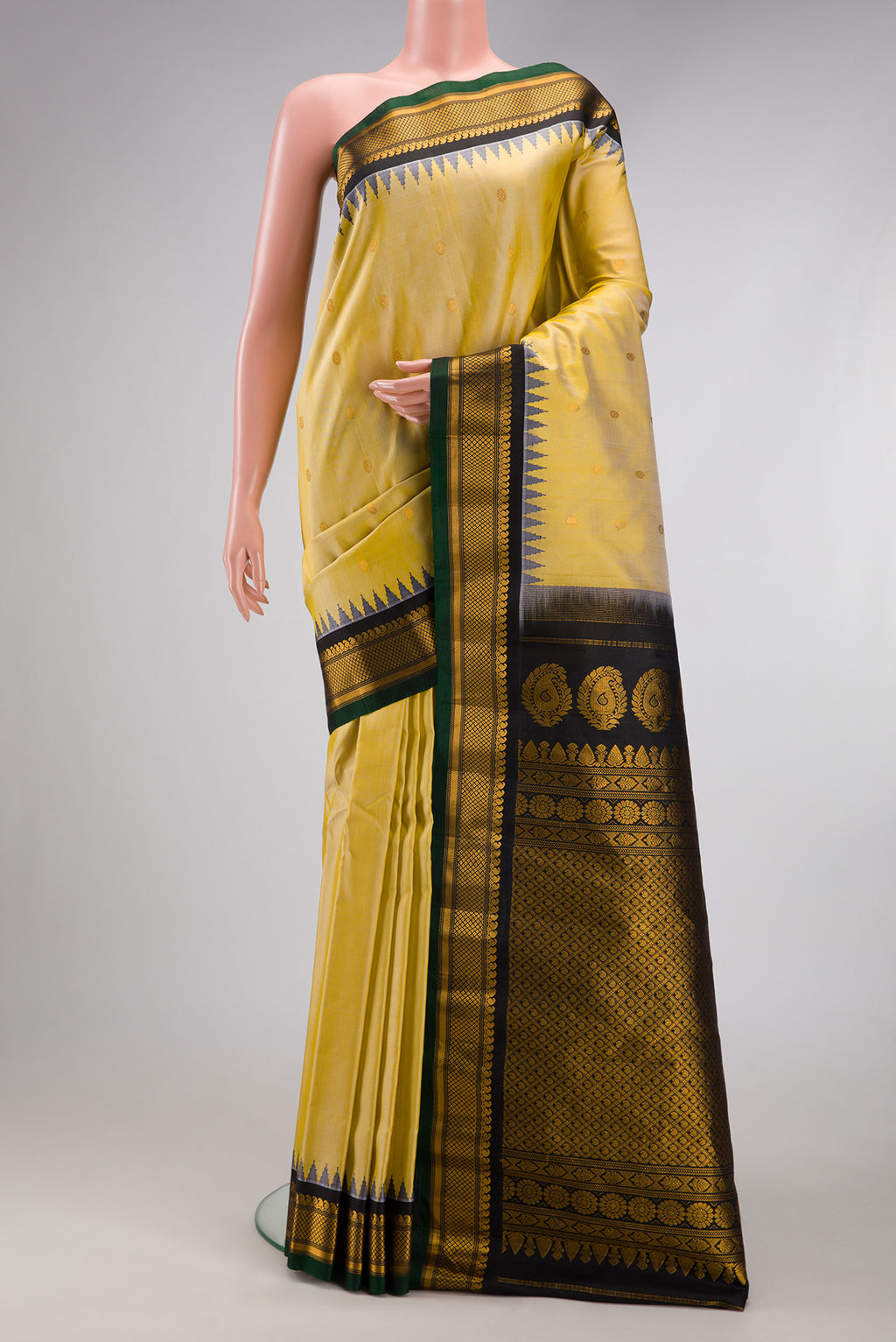 Sandal Gadwal Silk Saree with Zari Butta on the body and Zari Border.  displayed on a mannequin