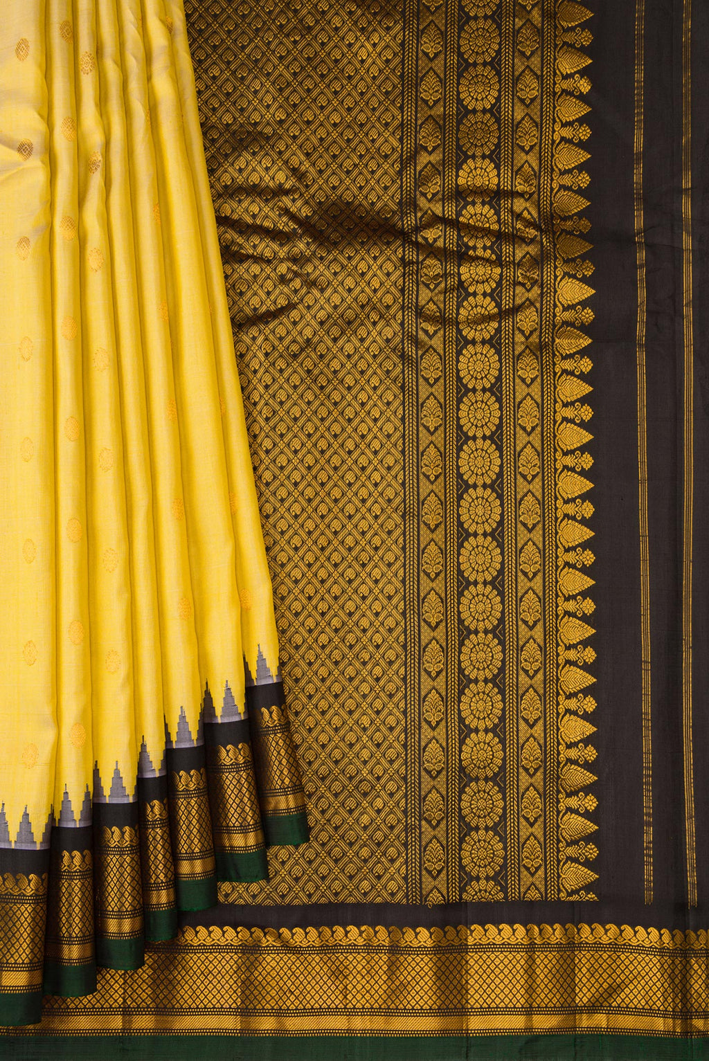 Pleats and pallu of Sandal Gadwal Silk Saree with Zari Butta on the body and Zari Border. 