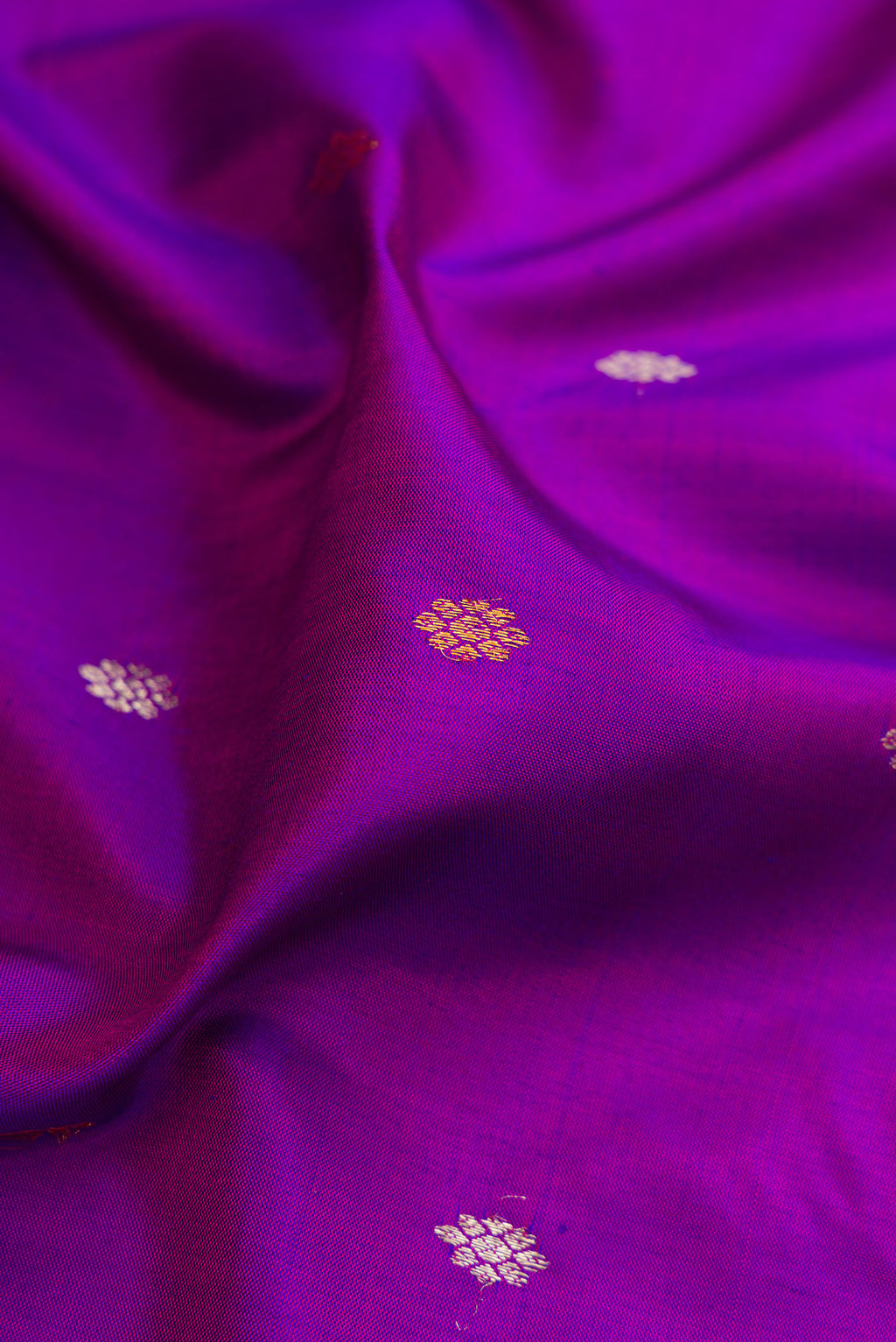 Close up of Purple Gadwal Silk Saree with Zari Butta on the body and Zari Border.  displaying folds