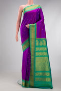 Purple Gadwal Silk Saree with Zari Butta on the body and Zari Border.  displayed on a mannequin